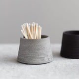 Handmade ceramic match striker in gray clay body with a ribbed texture to hold and light matches